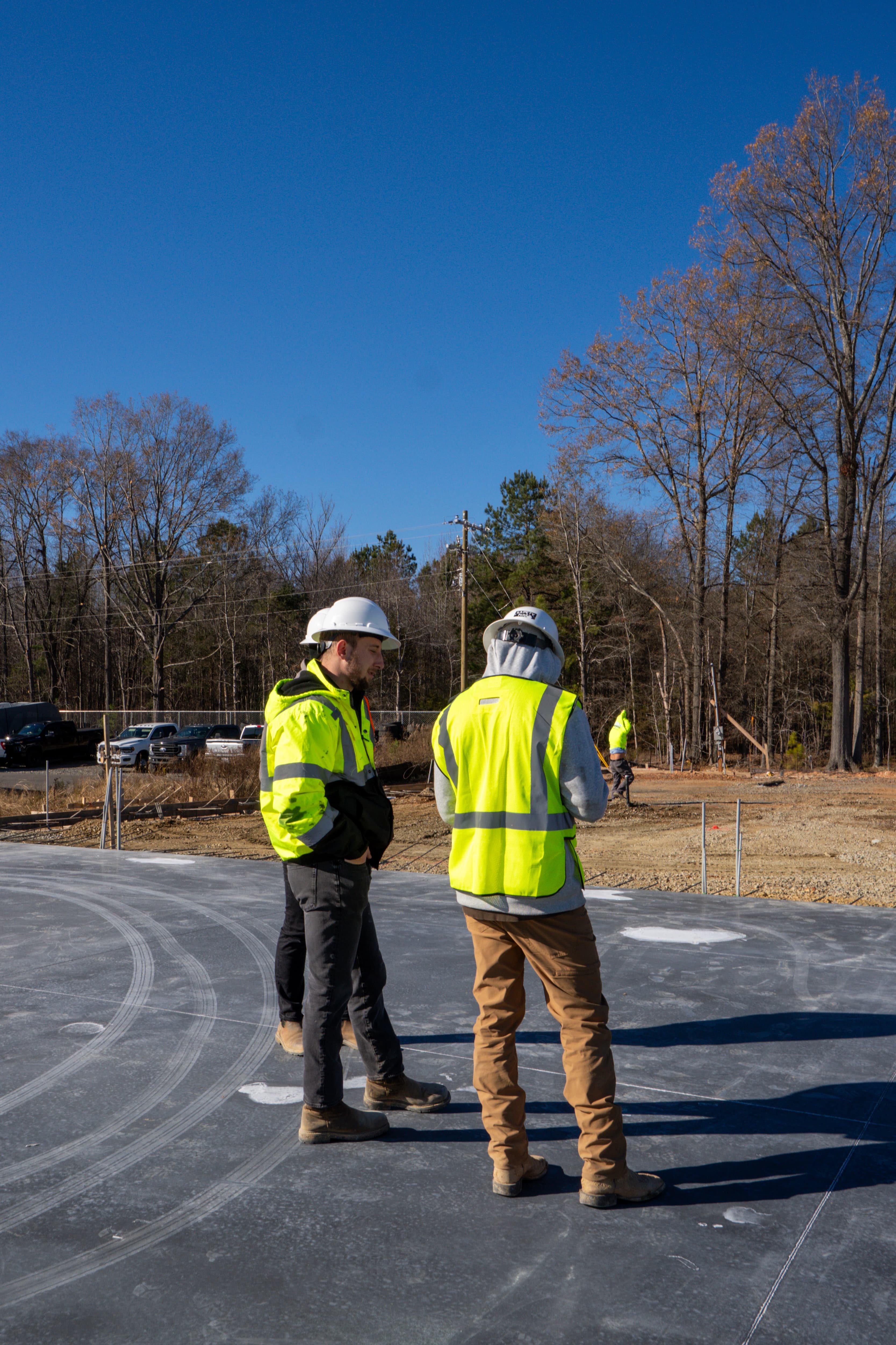 K&Y Builders team discussing a project on site